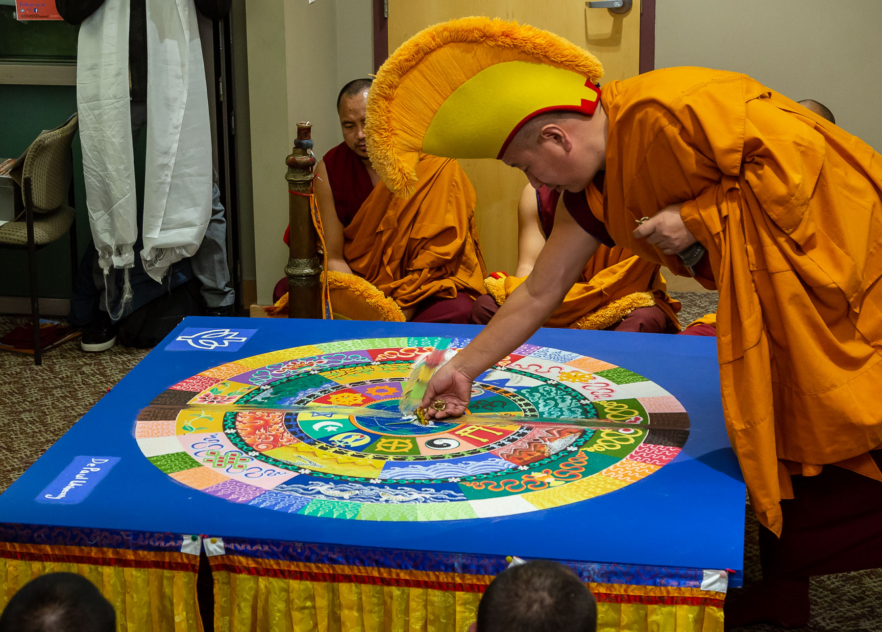 Monks customarily destroy mandalas immediatly after they are finish being created to bring fourth the underlying message that nothing is permanent. (DePaul University/Jeff Carrion)